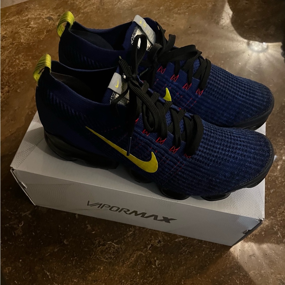 Used blue and black Nike vapor max